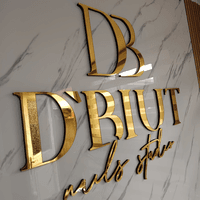 Salón de Manicure y Pedicure de D’biut Nails stuido logo